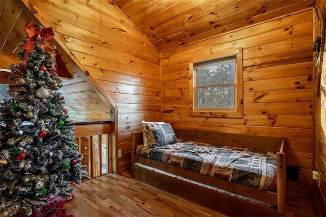 bedroom featuring lofted ceiling, wood ceiling, and wood finished floors