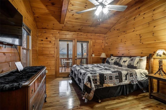 bedroom with vaulted ceiling, wooden ceiling, french doors, wood-type flooring, and access to outside