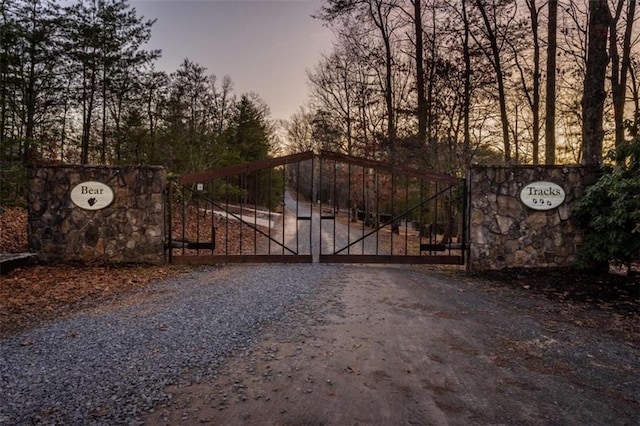 view of gate at dusk