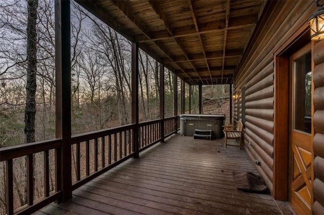 wooden terrace with a hot tub