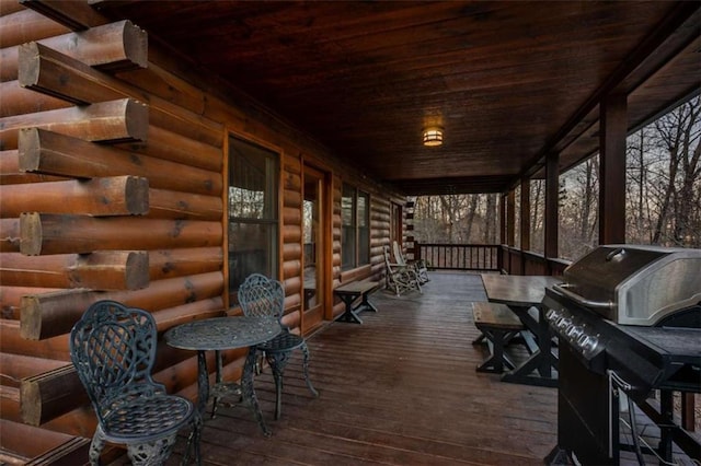 deck featuring a porch and a grill