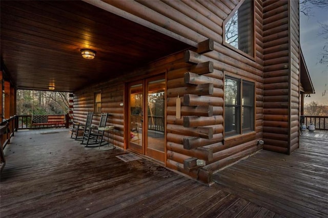 wooden terrace with visible vents and a porch