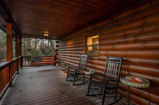 wooden terrace with covered porch