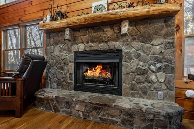 interior details featuring wood finished floors and a fireplace