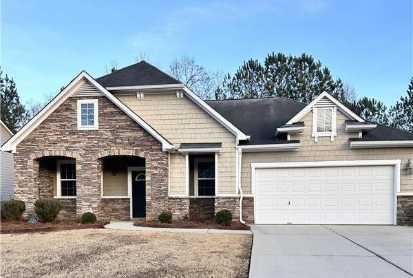 craftsman inspired home with a garage