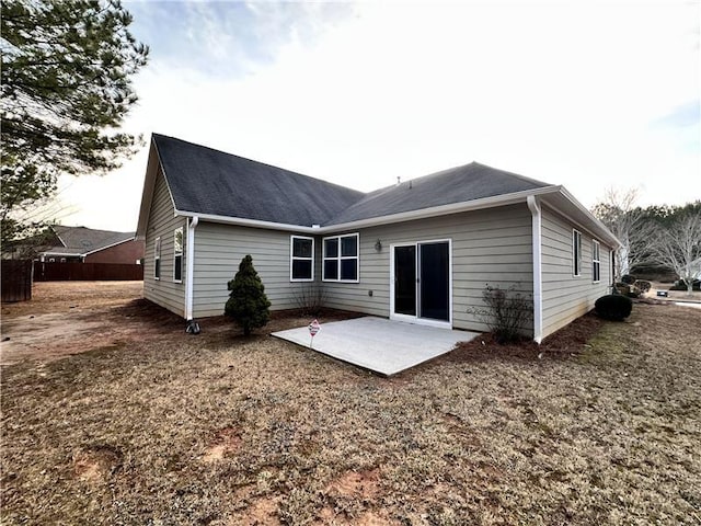 back of property featuring a patio area