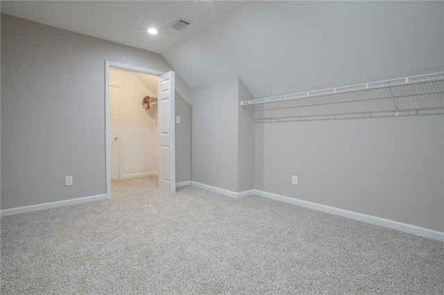 bonus room featuring lofted ceiling, recessed lighting, visible vents, baseboards, and carpet