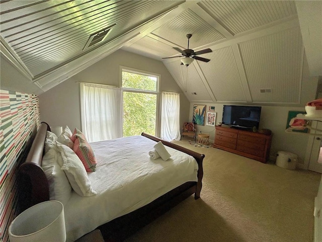 carpeted bedroom featuring lofted ceiling and ceiling fan