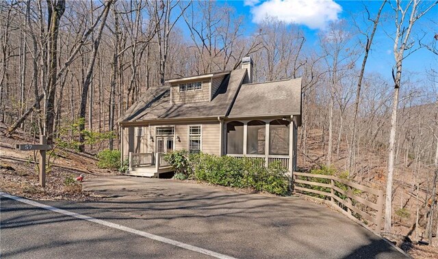 view of front of home with a sunroom