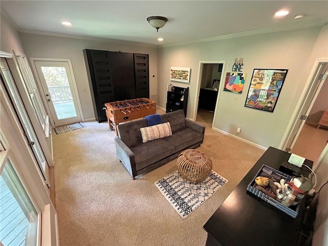 living area featuring crown molding, recessed lighting, baseboards, and light colored carpet