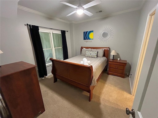 bedroom featuring carpet floors, visible vents, ornamental molding, a ceiling fan, and baseboards