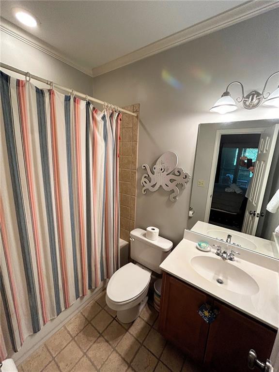 57 Shaggy Maple Ln, Big Canoe, GA 30143 - bathroom with vanity, crown molding, shower / bath combination with curtain, and tile patterned flooring