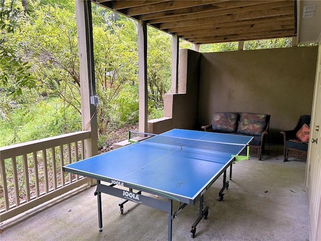 game room featuring concrete flooring