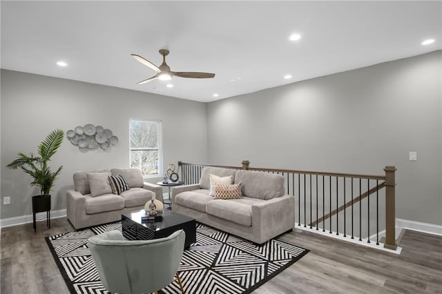 living room with recessed lighting, ceiling fan, baseboards, and wood finished floors