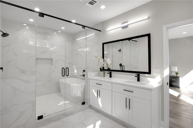 bathroom with recessed lighting, a sink, visible vents, marble finish floor, and a marble finish shower