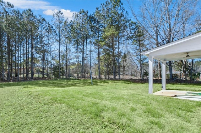 view of yard featuring a ceiling fan