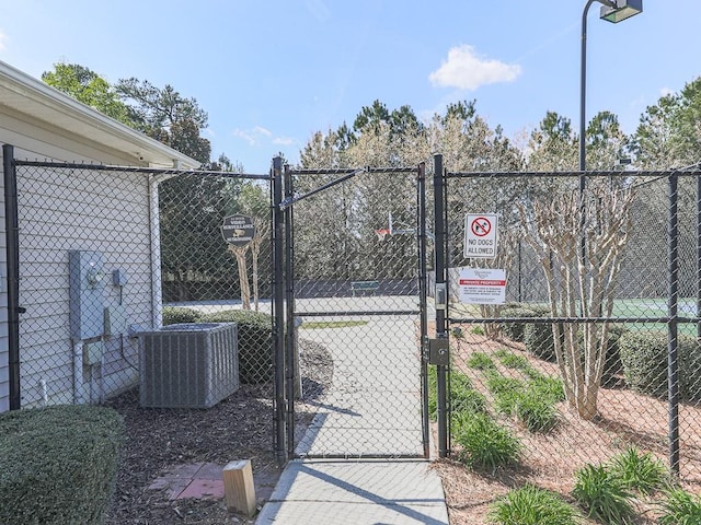 view of gate featuring central AC unit