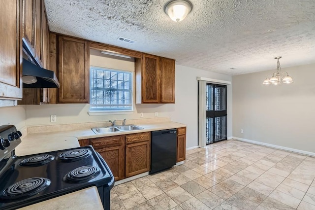 kitchen with visible vents, brown cabinets, light countertops, black appliances, and a sink