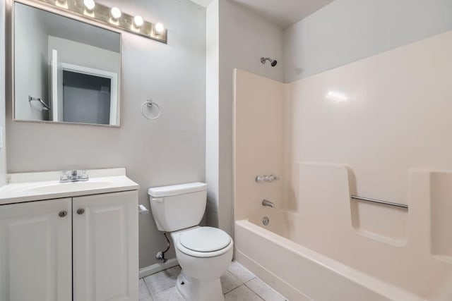 full bathroom featuring shower / washtub combination, toilet, vanity, baseboards, and tile patterned floors