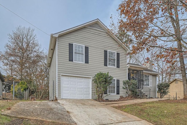 split level home featuring a garage and concrete driveway