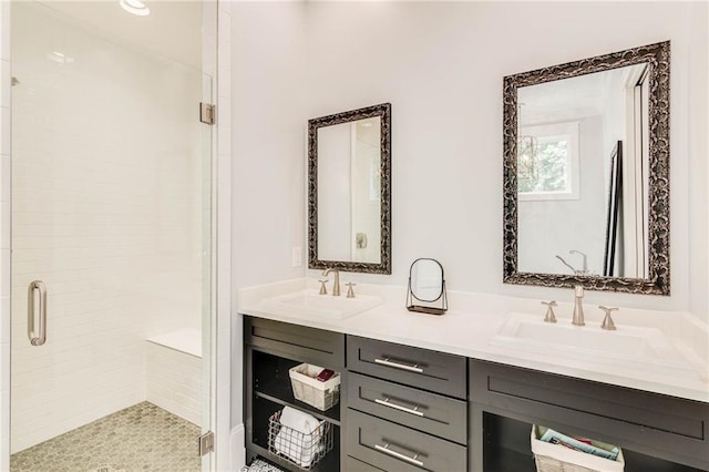 bathroom featuring vanity and a shower with shower door