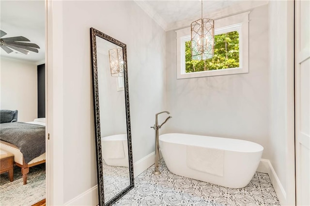 bathroom featuring crown molding, tile patterned floors, ceiling fan with notable chandelier, and a tub