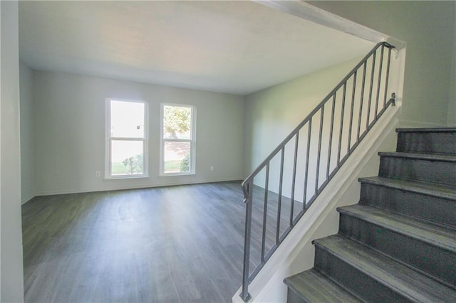 stairway featuring hardwood / wood-style flooring