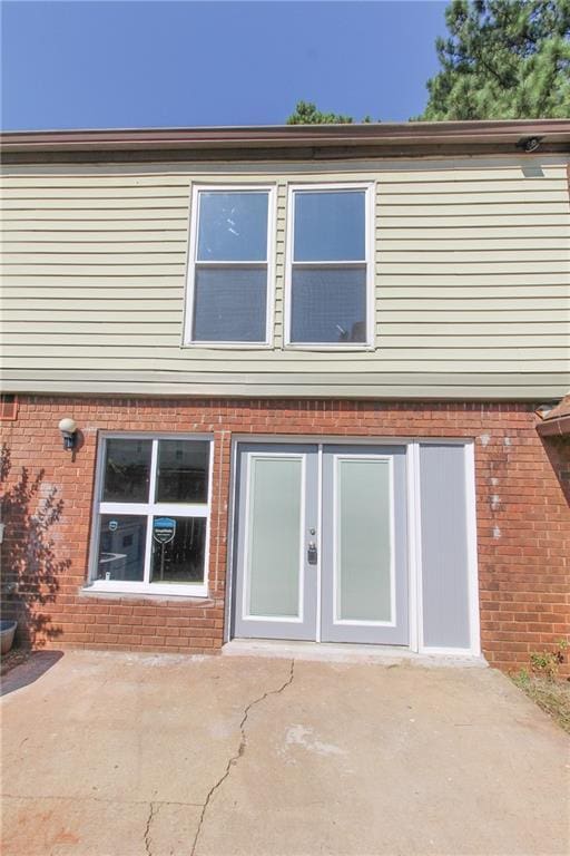 back of house with a patio and french doors