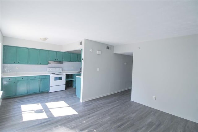 kitchen with electric stove, decorative backsplash, and dark wood-type flooring