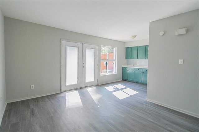 interior space with french doors and dark hardwood / wood-style floors