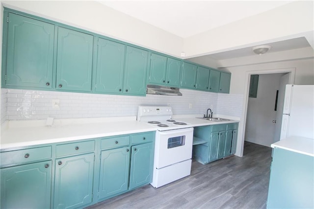 kitchen featuring white appliances, backsplash, dark wood-type flooring, and sink