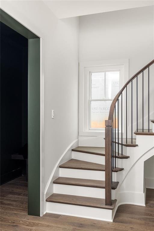 stairway with hardwood / wood-style floors