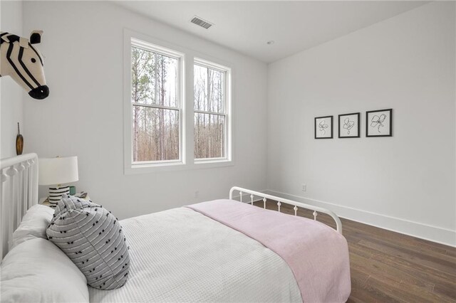 bedroom featuring dark hardwood / wood-style floors