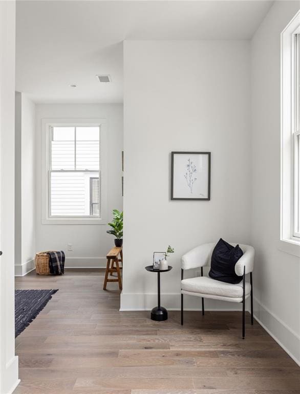 sitting room featuring light hardwood / wood-style floors