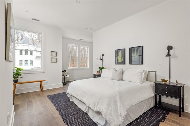 bedroom with light hardwood / wood-style floors