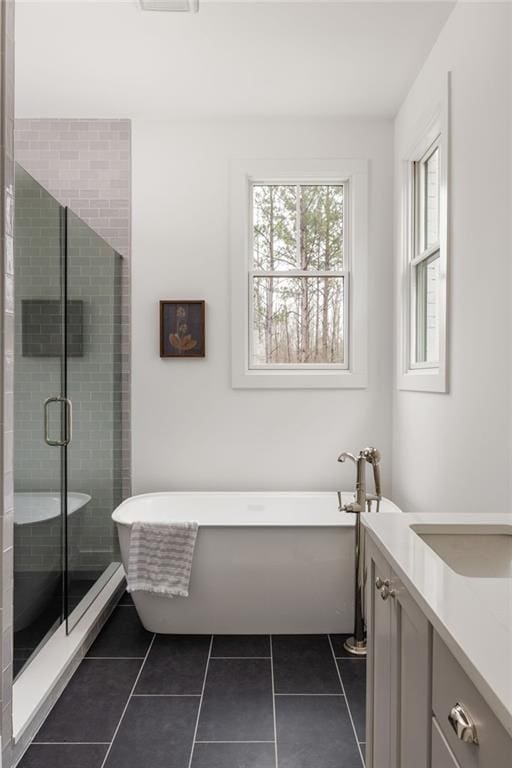 bathroom featuring vanity, separate shower and tub, and tile patterned flooring