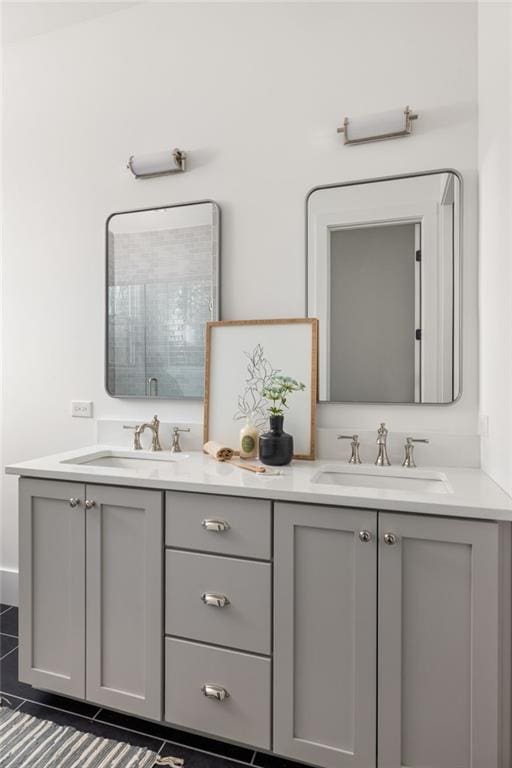 bathroom with walk in shower and vanity