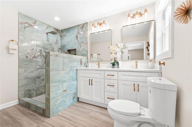 1675 White Oak Way, Decatur, GA 30032 - full bathroom with double vanity, wood finished floors, a walk in shower, and recessed lighting