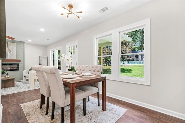 1675 White Oak Way, Decatur, GA 30032 - dining space with plenty of natural light, a glass covered fireplace, dark wood-type flooring, and recessed lighting