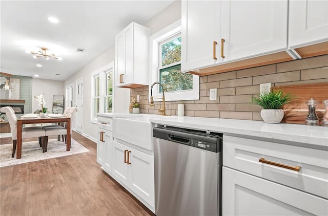1675 White Oak Way, Decatur, GA 30032 - kitchen with stainless steel dishwasher, white cabinetry, light wood-type flooring, recessed lighting, and decorative backsplash