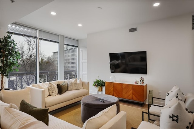 living room with floor to ceiling windows