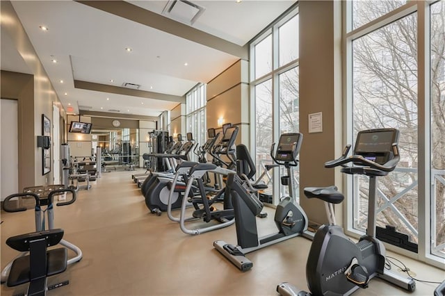 gym featuring floor to ceiling windows