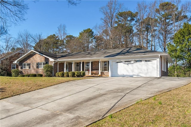 ranch-style house featuring a garage, brick siding, concrete driveway, and a front yard