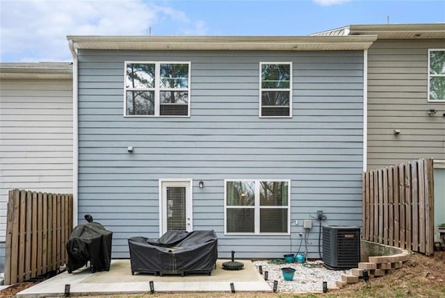 back of house featuring a patio area, fence, and central AC unit