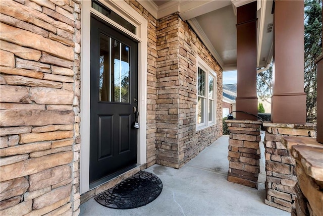 property entrance featuring a porch