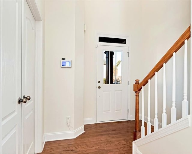 foyer entrance featuring dark hardwood / wood-style floors