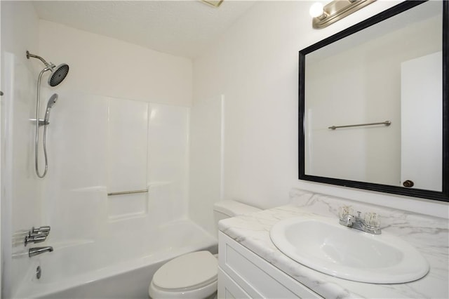 full bathroom featuring toilet, tub / shower combination, and vanity