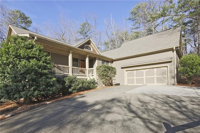 view of front of house with covered porch and a garage