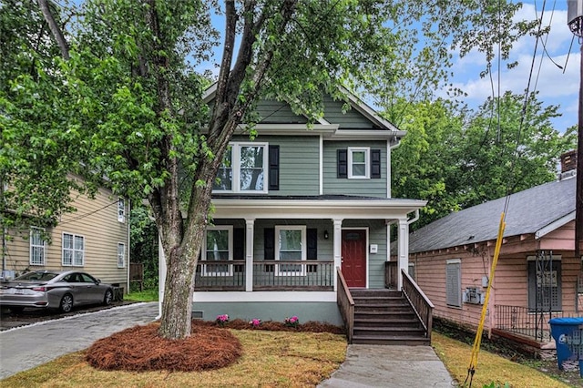 traditional style home featuring covered porch