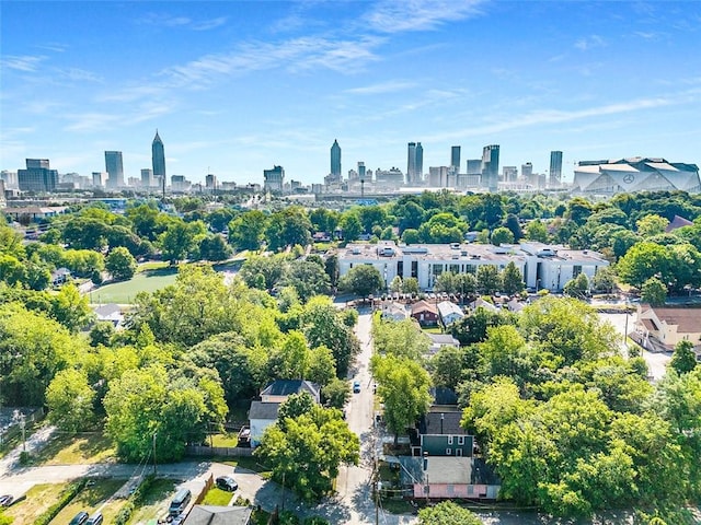 aerial overview of property's location featuring a view of skyline
